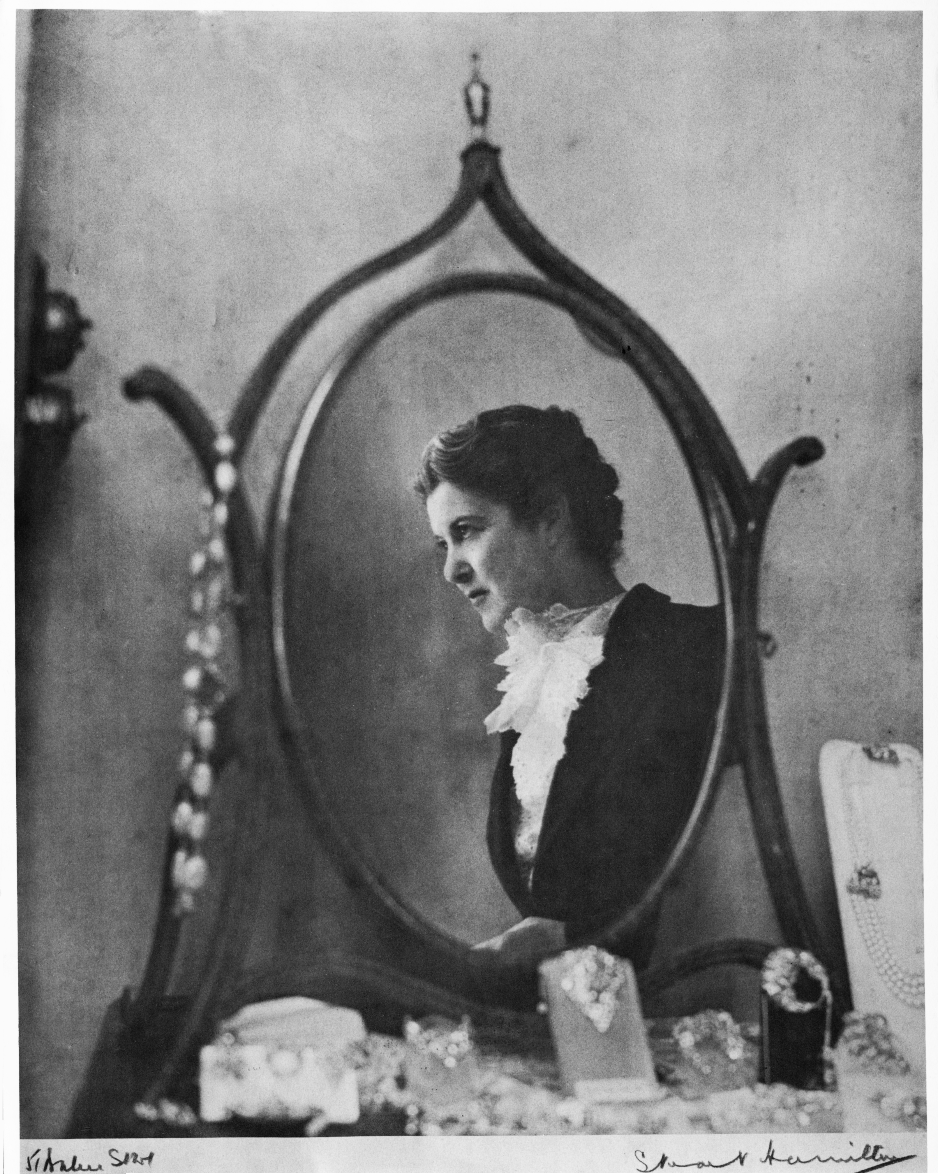 Portrait of Dorrie Nossiter with examples of her jewllery Image