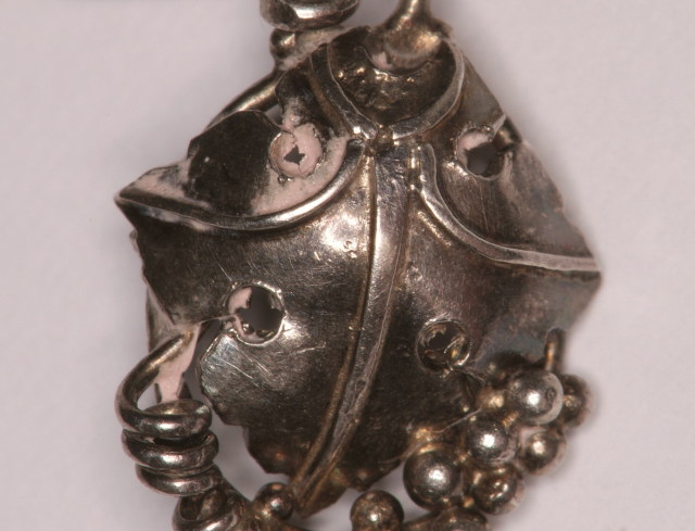 Close-up of a vine leaf and part of a spiral in one of Dorrie's pieces. Image