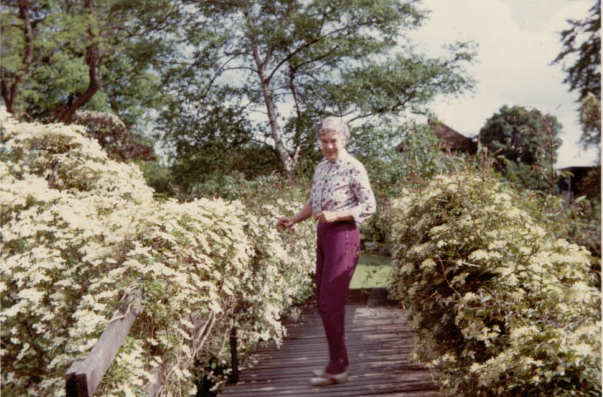 Dorrie at Riverbank on the bridge joining two parts of the garden Image