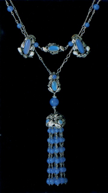 This piece is difficult as there are are some features of Sybil in the symmetry, but the leaves and grape bunches are more naturalistic indicative of Dorrie's work. Image